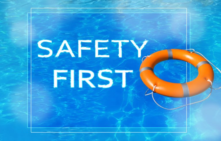 Safety first. Life buoy in swimming pool with clean blue water